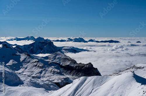 beautiful day above the fog on 3000m on Schilthorn in the Swiss alps photo