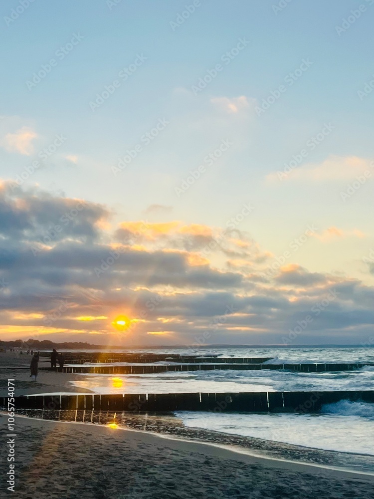 Fototapeta premium Sunset at the sea, sandy seashore