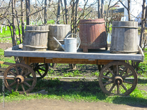 old Russian wheeled cart with wooden tubs