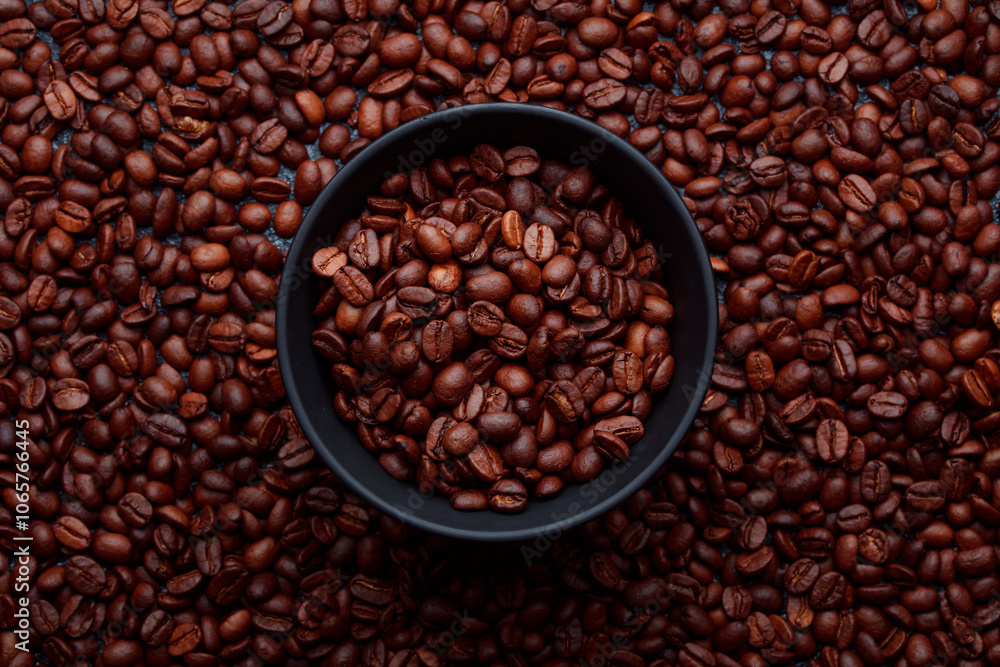Fototapeta premium Roasted coffee beans in bowl. Rusty background for coffee shop menu. Top view and copy space.
