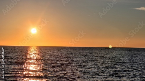 Sea, beach and pebbles, clouds in the sea. photo