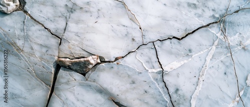 Cracks vein through a slab of marble, revealing nature’s beauty in imperfection with its delicate, complex pattern against a white backdrop. photo