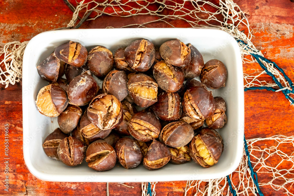 Fototapeta premium Traditional Portuguese Christmas roasted chestnuts