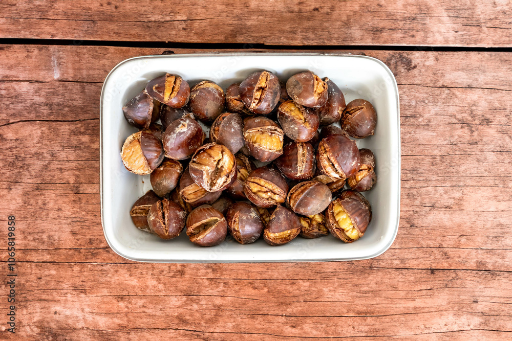 Fototapeta premium Traditional Portuguese Christmas roasted chestnuts