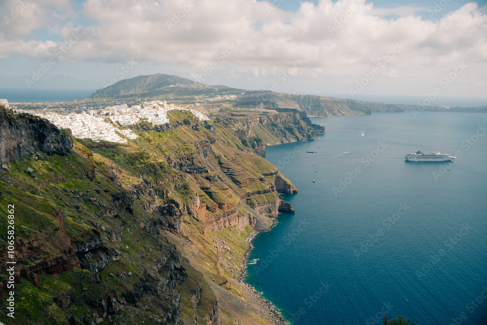 Fototapeta premium Early morning view of bay on Santorini island, Greece. the luxury cruise ships in the bay