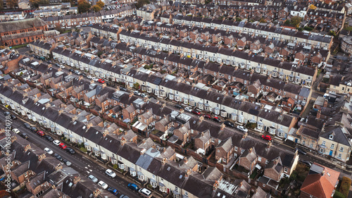 Aerial view above rows of back to back terraced houses on a large council estate in the UK