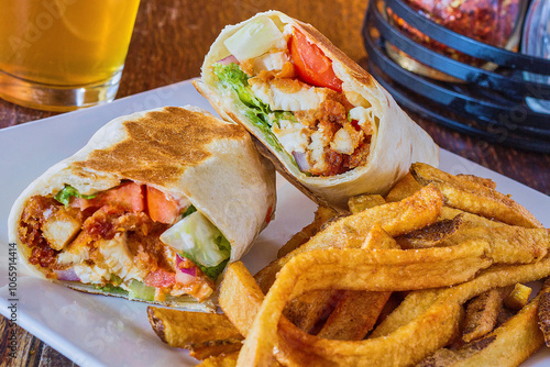crispy fried chicken tender wrap served with french fries