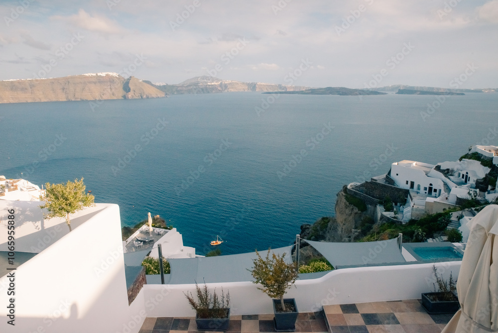 Obraz premium Fira town by the sea on mountain coast of Santorini island in Greece - 2 may 2024