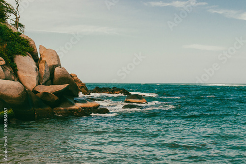 Beautiful landscape with ocean view and blue sky on the beaches of Tayrona Park. Santa Marta, Colombia.