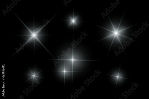 Silver sparkle lights, flashing lights, light effects, sunlight lens flare, glowing ray beams, sparkling starsicon on black background. photo