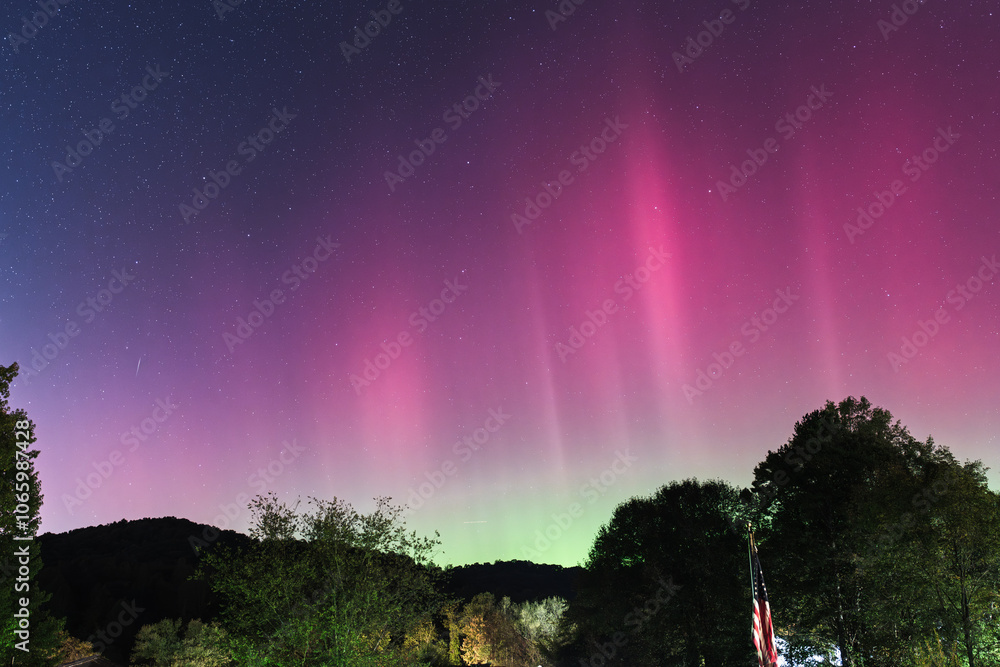 Vibrant Pink and Green Aurora Borealis Illuminating the Night Sky
