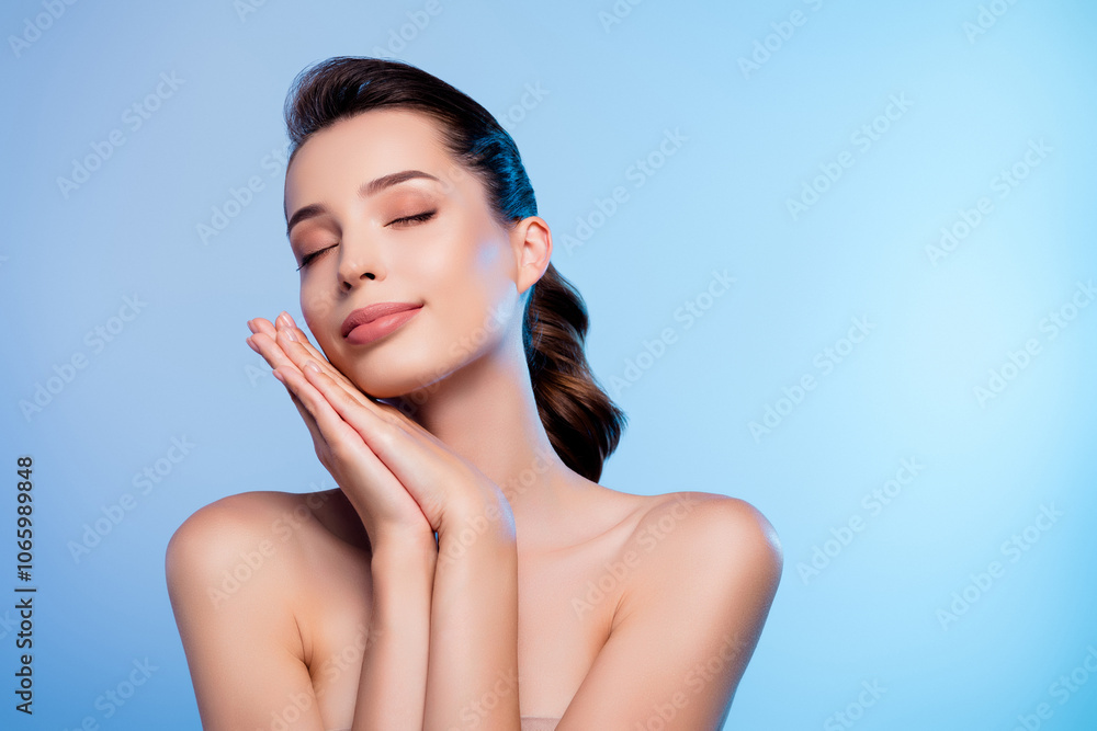 Φωτογραφία Photo of pretty girl close eyes touch hands face feel tender skin isolated blue