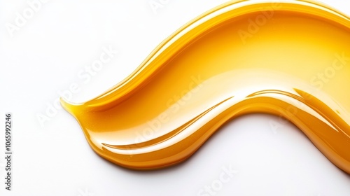 Smooth smear of golden-yellow petroleum jelly in glossy, translucent swatch on a pure white background, soft light reflections highlighting texture photo