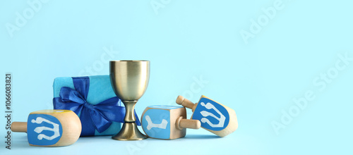 Dreidels with cup and gift ...