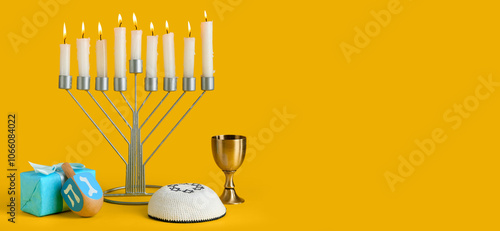 Menorah with burning candle...