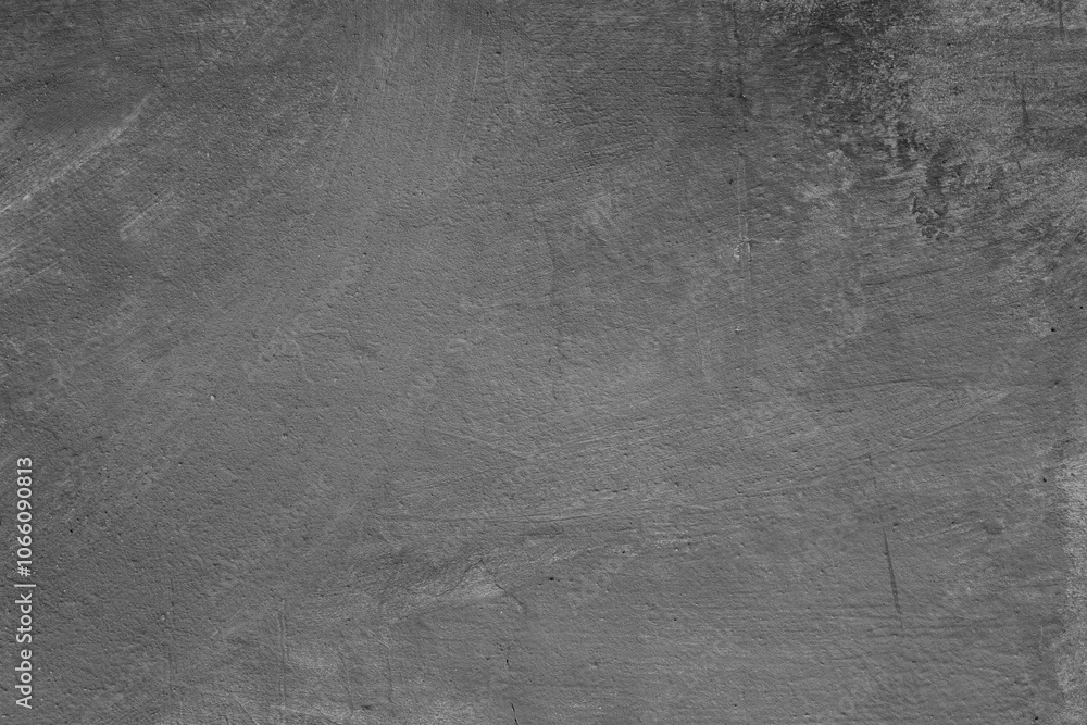Naklejka premium Monochrome texture of a concrete wall with natural relief and damage in the form of chips and scratches. Fragment of an old stone surface with a crack. Dark rough surface with a place for an inscripti