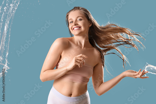 Happy young woman with spla...