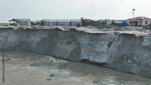 River Erosion in Bangladesh: Homes are disappearing on the river banks. 4k video smooth video shoot