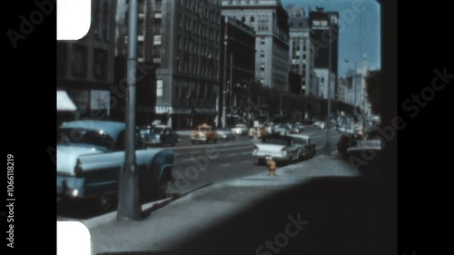 Michigan Avenue Looking North 1957 - Looking north on Michigan Avenue in Chicago, Illinois as traffic passes and the historic Chicago Water Tower and Palmolive Building are seen, in 1957.