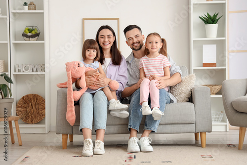 Happy family with toy rabbi...