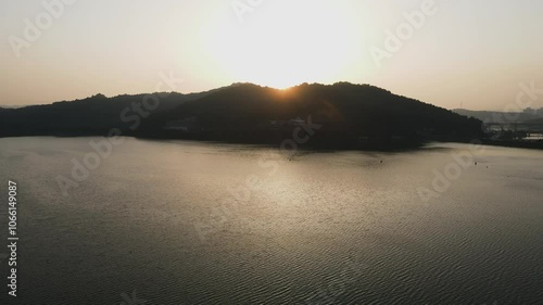 take an aerial shot of the sunset of Sinjungho Lake