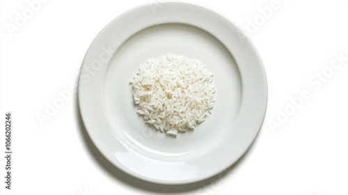 Plate with a small portion of rice on a white background symbolizing hunger