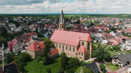 Aerial of Rauenberg town with community catholic church building in view photo