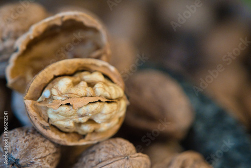 Half open walnut against a blurry background photo