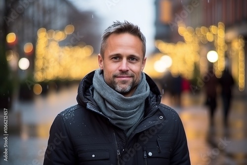 Portrait of a handsome man on a city street at night.