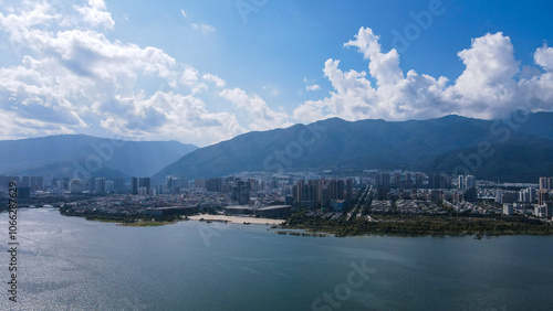 urban riverfront cityscape with mountain background in Dali city,Yunnan,China