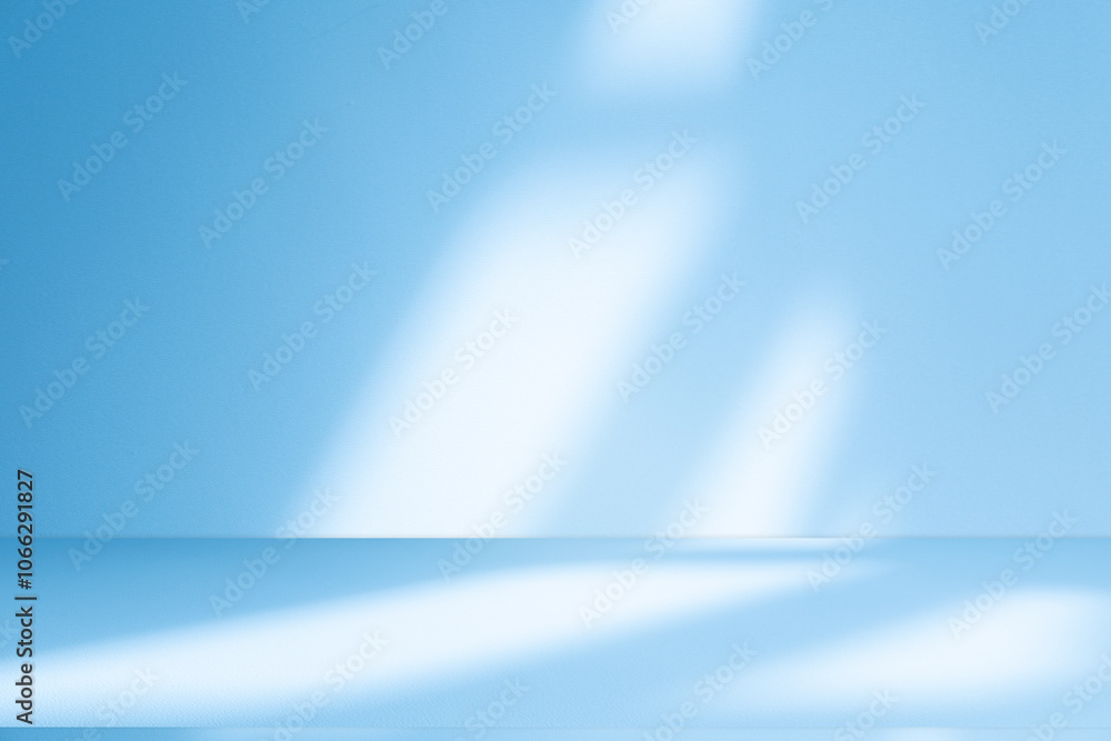 Wall interior background, studio and backdrops show products.with shadow from window color white and blue background for text insertion and presentation product Wall interior background, studio and backdrops show products.with shadow from window color white and blue background for text insertion and presentation product