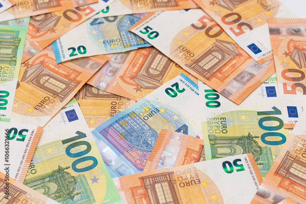 Different Euro Banknotes Money Background. Euro Money Currency. Colored Paper Money. A Lot of Fifty Euro Bills. Business, Finances, Cash and Money Saving Concept Different Euro Banknotes Money Background. Euro Money Currency. Colored Paper Money. A Lot of Fifty Euro Bills. Business, Finances, Cash and Money Saving Concept