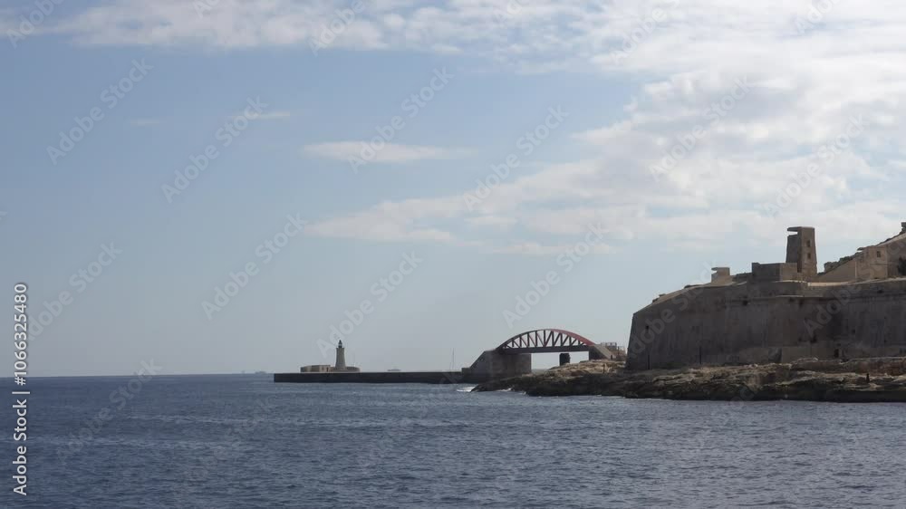 Valletta, Malta A ship approach to the Valletta Harbour and the landmark and illuminated Ball's Bastion and ancient city walls. Valletta, Malta A ship approach to the Valletta Harbour and the landmark and illuminated Ball's Bastion and ancient city walls.