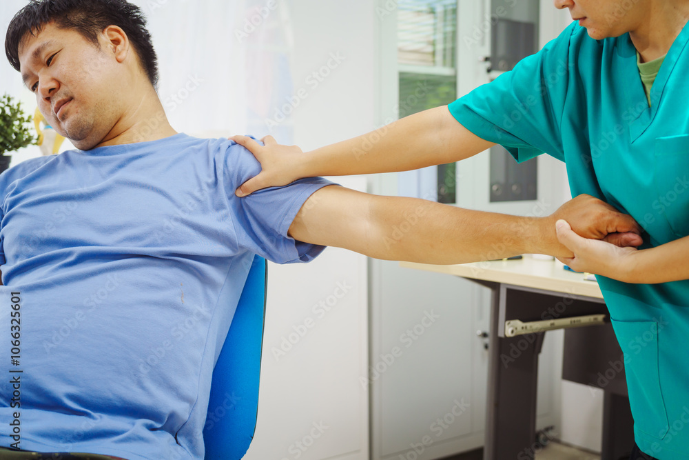 A female doctor performs physical therapy on a male patient in the hospital, using techniques like pulling, massaging, and compressing to rehabilitate injuries, relieve pain,restore daily functional A female doctor performs physical therapy on a male patient in the hospital, using techniques like pulling, massaging, and compressing to rehabilitate injuries, relieve pain,restore daily functional