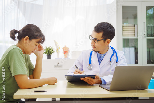 A male doctor sits at a desk in a hospital,reviewing a female patient’s medical history.He provides compassionate advice for depression, addressing symptoms like sadness,hopelessness, anger, anxiety