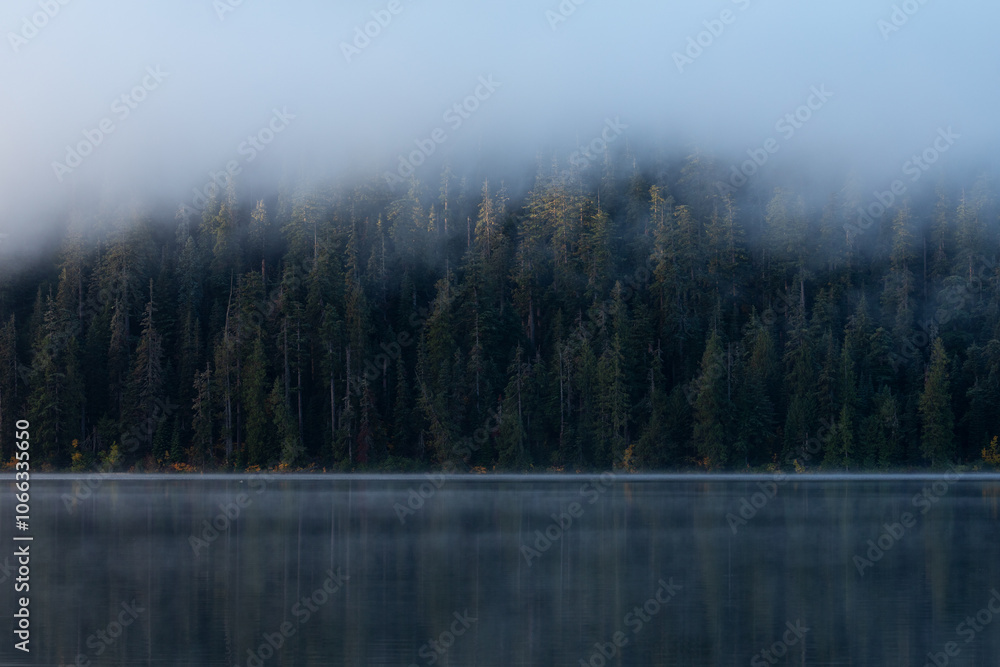 Beautiful misty fall weather, autumn vibes at Lost Lake in Oregon, near Hood River and Mount Hood, captured during early morning. Mystic fall vibes and scenery. Beautiful misty fall weather, autumn vibes at Lost Lake in Oregon, near Hood River and Mount Hood, captured during early morning. Mystic fall vibes and scenery.
