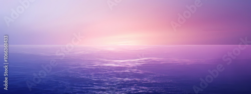 Serene ocean horizon at sunset, displaying calming hues of purple and blue, creating a tranquil and peaceful atmosphere.