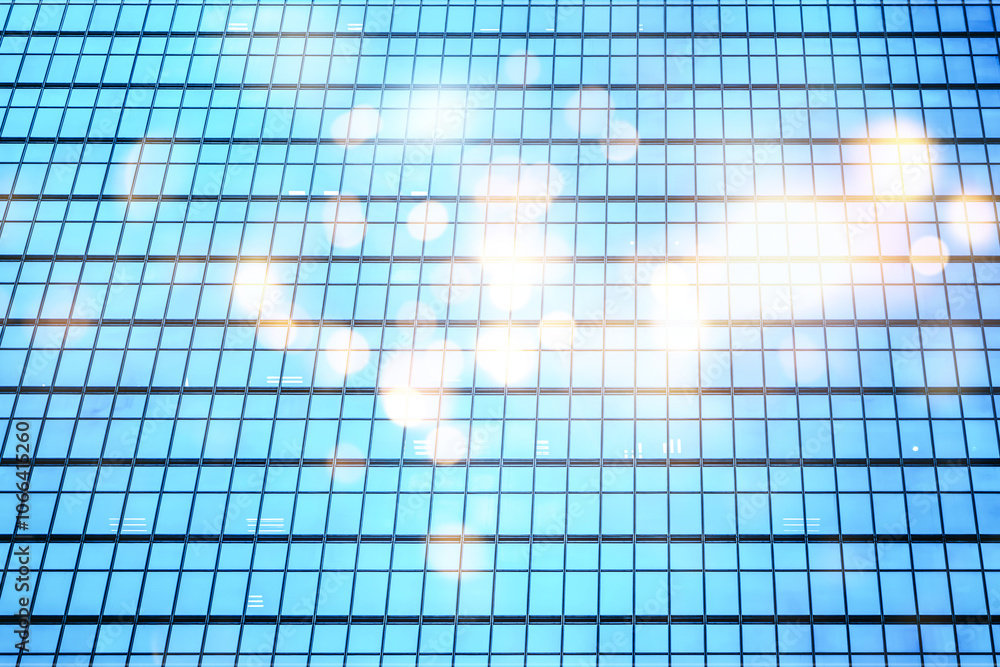 An abstract image of a skyscraper with a grid pattern of windows, with blurred light reflecting off the glass. An abstract image of a skyscraper with a grid pattern of windows, with blurred light reflecting off the glass.