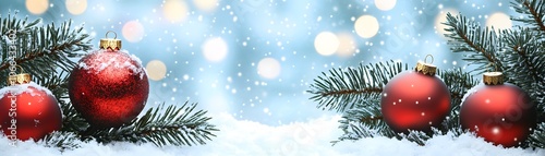 Red Christmas Ornaments on Snowy Pine Branches with Bokeh Lights