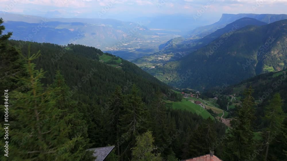 Charming cabin nestled in dense Vigiljoch forests, overlooking the expansive Merano Valley and surrounding mountains in South Tyrol, Italy, on a clear day. Charming cabin nestled in dense Vigiljoch forests, overlooking the expansive Merano Valley and surrounding mountains in South Tyrol, Italy, on a clear day.