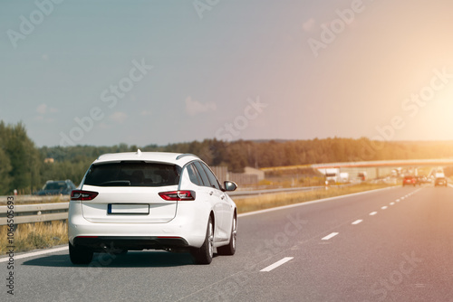 White combi car driving along the highway photo