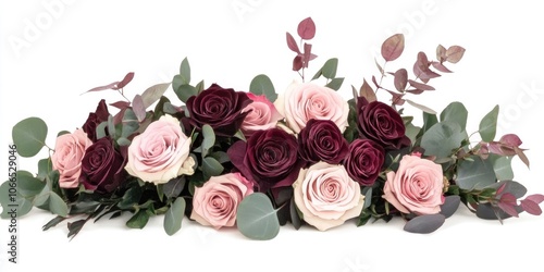 Fototapeta Naklejka Na Ścianę i Meble -  A collection of assorted pink and burgundy roses accompanied by eucalyptus is set against a white backdrop. This arrangement features a blend of lovely pink and rich burgundy hues.