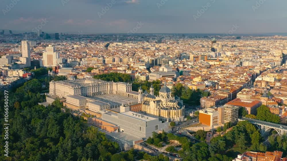 MADRID, SPAIN - OCTOBER 28, 2024: Aerial view of Madrid showcasing the Royal Palace and bustling cityscape during sunset MADRID, SPAIN - OCTOBER 28, 2024: Aerial view of Madrid showcasing the Royal Palace and bustling cityscape during sunset