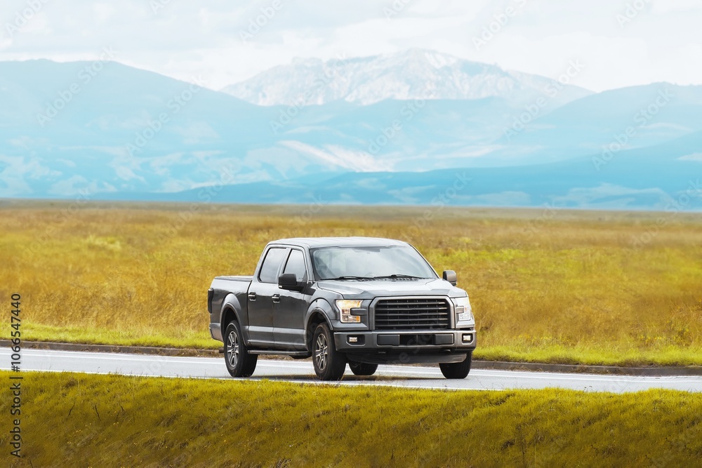 Sturdy pickup truck on a misty rural road Sturdy pickup truck on a misty rural road