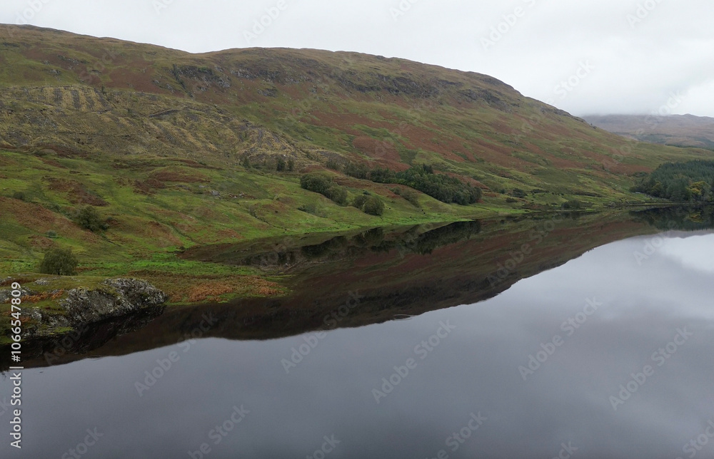Gorgeous reflection over Loch Lubnaig in Scotland, during a cloudy and misty day. Found this gem during a roadtrip in Scotland. Gorgeous reflection over Loch Lubnaig in Scotland, during a cloudy and misty day. Found this gem during a roadtrip in Scotland.