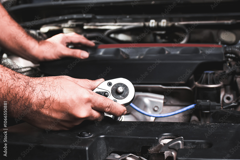 Mechanic working on car engine with tools , Car repair concept Mechanic working on car engine with tools , Car repair concept