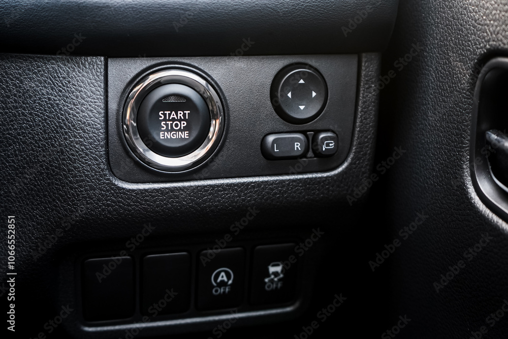 Close up engine car start button. Start stop engine modern new car button,Makes it easy to turn your auto mobile on and off. a key fob unique ,selective focus Close up engine car start button. Start stop engine modern new car button,Makes it easy to turn your auto mobile on and off. a key fob unique ,selective focus
