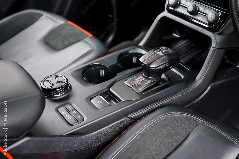 automatic transmission shift selector in the car interior. Closeup a manual shift of modern car gear shifter. 4x4 gear shift automatic transmission shift selector in the car interior. Closeup a manual shift of modern car gear shifter. 4x4 gear shift
