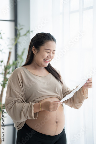 Pregnant asian woman holding ultrasound baby Image Result from Doctor. Happy mother mindfulness Positive life moment in pregnancy time. health care Free Download Pregnant asian woman holding ultrasound baby Image Result from Doctor. Happy mother mindfulness Positive life moment in pregnancy time. health care - GFXLoad