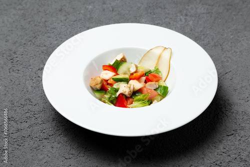 Wallpaper Mural Fresh vegetable salad with chicken and pear. On a gray background. Photo for the menu. Torontodigital.ca